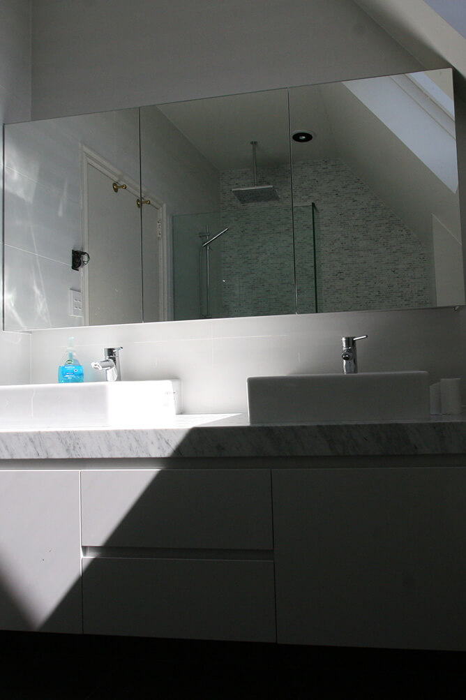 photo of bathroom sinks and mirror